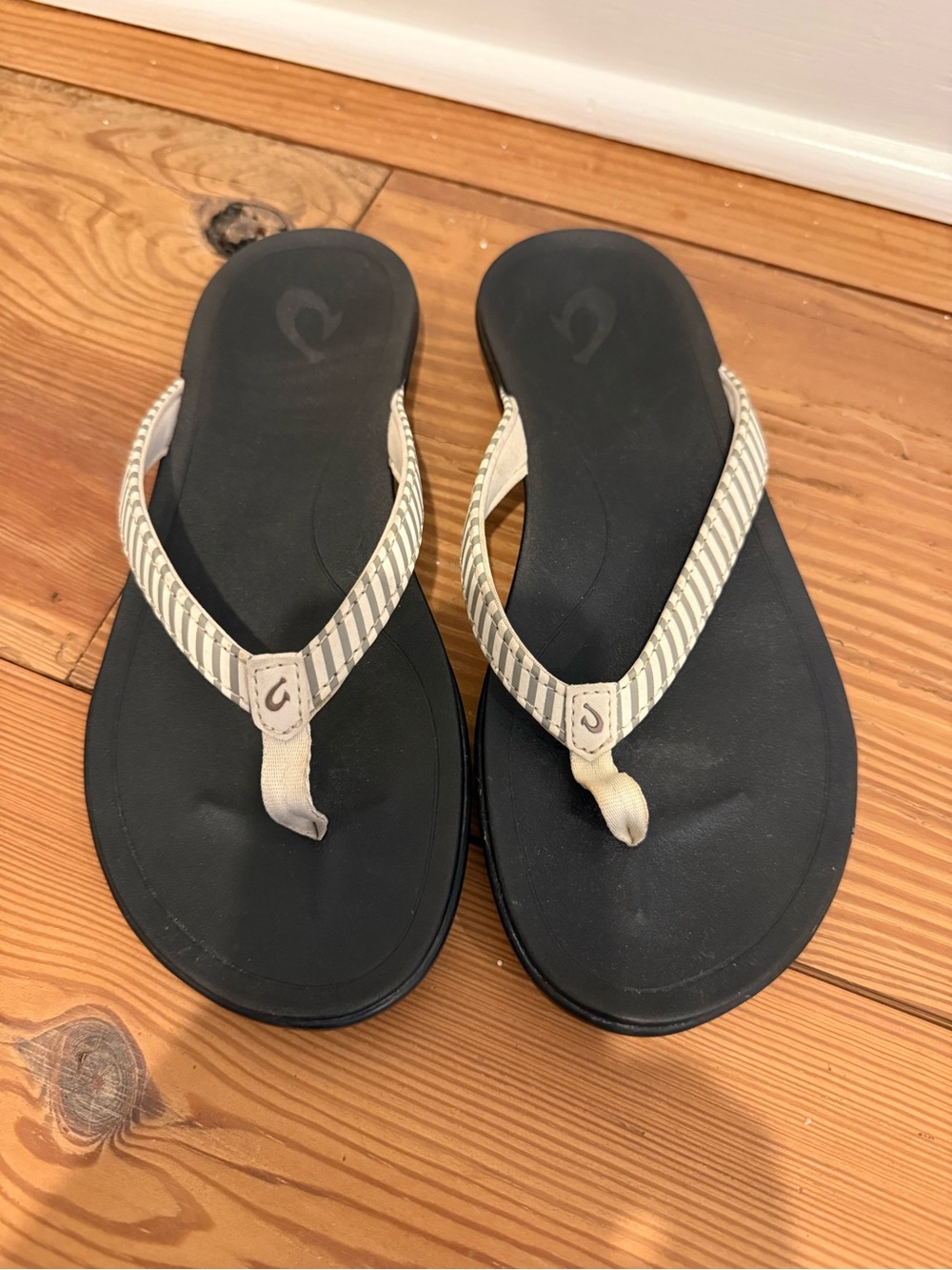 OluKai Black Footbed Flip Flop with Cream Striped Straps